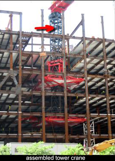 fully assembled tower crane which will climb on within the steel building frame